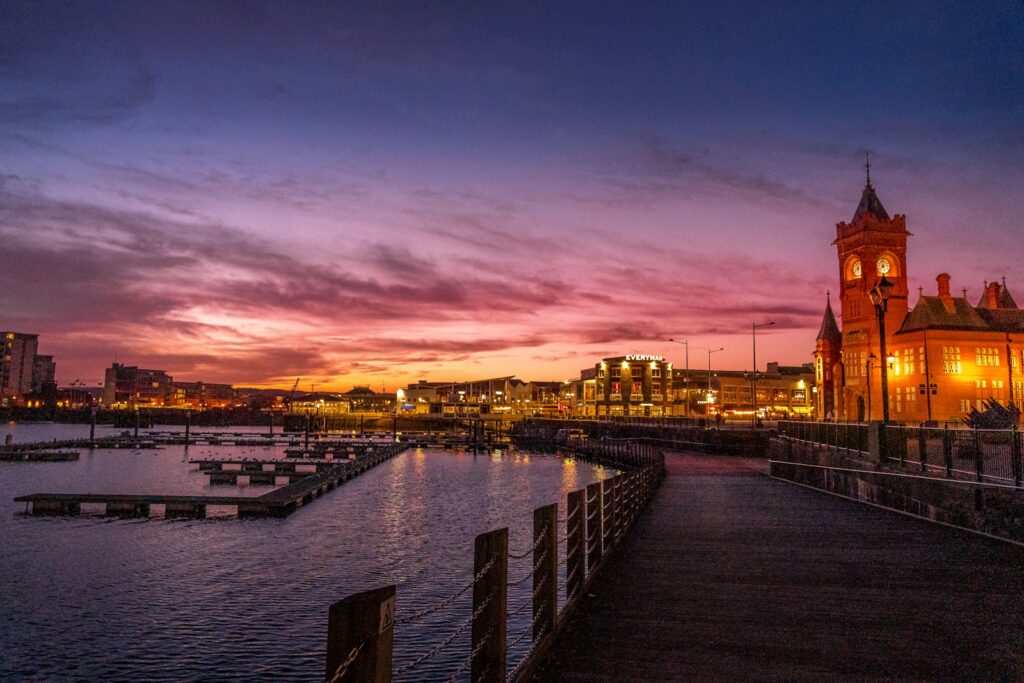 Cardiff Bay waterfront at sunset; illustrative photograph, not a photograph of the September 2026 summit.